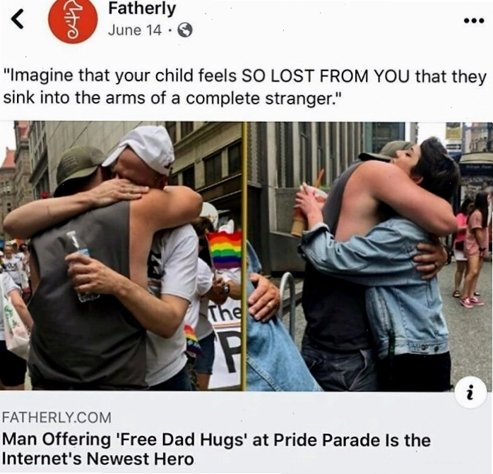 Hai người đàn ông ôm nhau tại lễ diễu hành Pride